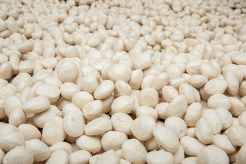 Many pork balls are in a stainless steel basin.