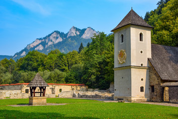 Stunning view of medieval Red Monastery (Cerveny Klastor), Slovakia. Three Crowns mountain range in the background