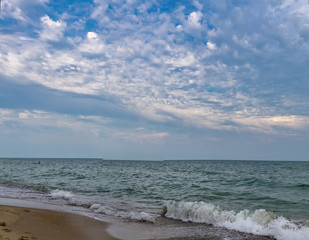Sea view from tropical beach with sunny sky.