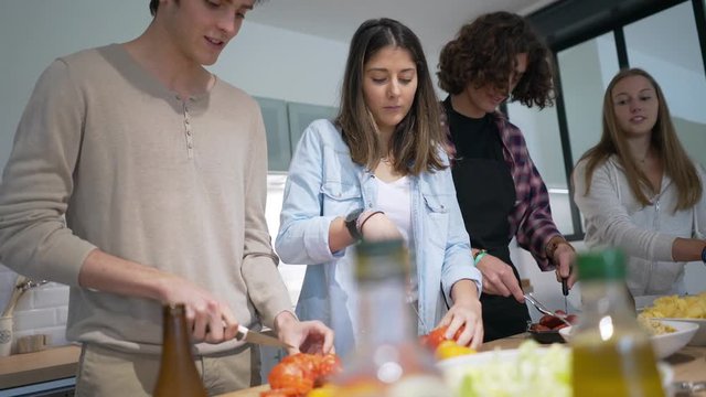 Flatmates cooking together at home