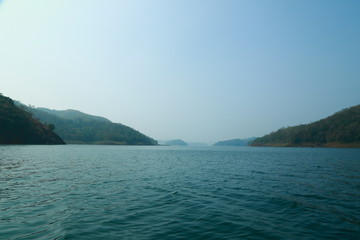 Fototapeta premium Misty morning mountain in a dam. 
