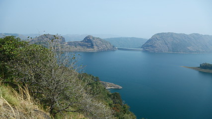 Misty morning mountain in a dam.
