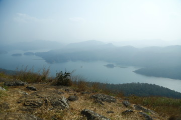 Misty morning mountain in a dam.
