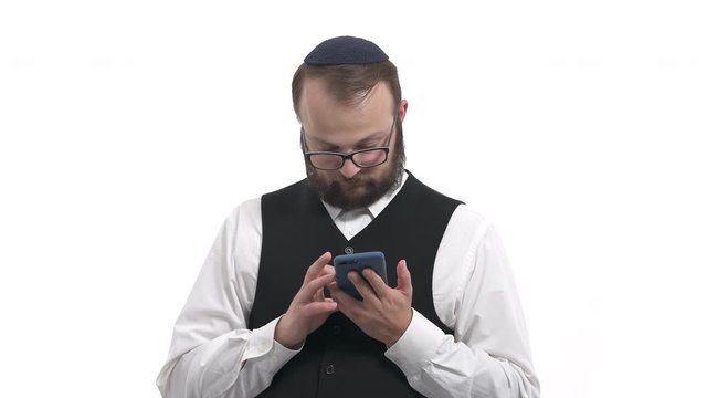 Man using smartphone. Model seriously and carefully reading news from gadget. Isolated, on white background