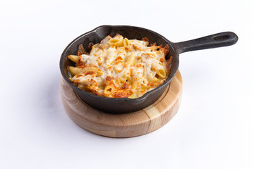 Pasta bake with whole wheat penne. isolated on white background