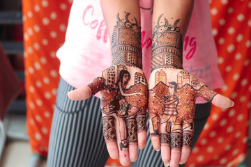 Indian bride showing mehndi tattoos design