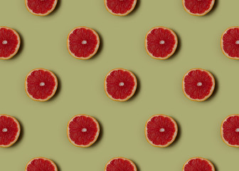 Grapefruit on soft green background. Healthy eating.