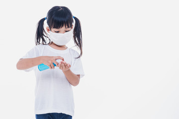 Asian little cute girl wearing a  mask to protective spread the disease on white background. Prevention of spreading the corona virus COVID-19 cold flu or pollution.