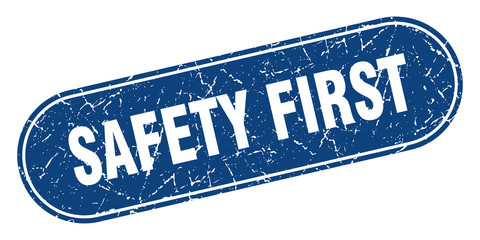 safety first sign. safety first grunge blue stamp. Label