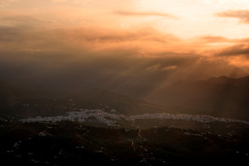Sun rising over the Town of  Frigiliana, Malaga Province, Axarquia, Andalusia, southern Spain.