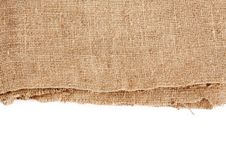 Brown burlap laying on white sheet. Abstract background. Texture of sackcloth. Background for banners, or wallpapers. Burlap Fabric Patch Piece, Rustic Hessian Sack Cloth