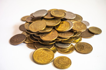 hill of Polish coins on a white background close-up
