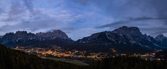 Autumn night Cortina d'Ampezzo alpine Dolomites mountain town, Belluno, Italy. Picturesque traveling and countryside beauty concept scene. © wildman