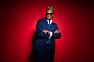 Photo of handsome selfish dark skin business guy bossy person golden diadem on head arms crossed...