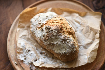 homemade bread with sesame seeds. cook in the kitchen at home during the coronavirus crisis. Stay at home. Enjoy cooking at home. Wholemeal bread. Healthy bread