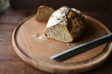 homemade bread with sesame seeds. cook in the kitchen at home during the coronavirus crisis. Stay at home. Enjoy cooking at home. Wholemeal bread. Healthy bread