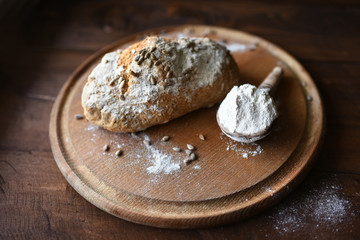 homemade bread with sesame seeds. cook in the kitchen at home during the coronavirus crisis. Stay at home. Enjoy cooking at home. Wholemeal bread. Healthy bread