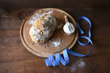 homemade bread with sesame seeds. cook in the kitchen at home during the coronavirus crisis. Stay at home. Enjoy cooking at home. Wholemeal bread. Healthy bread