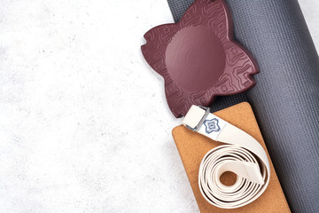 Yoga set accessories on pink background