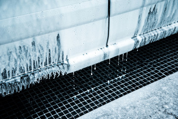 Fototapeta premium Washing car with soap. Close up clean car concept at car wash.