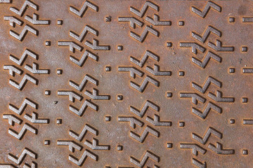 Manhole cover metallic backdrop