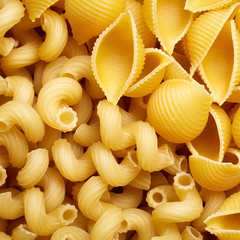 Classic durum wheat pasta isolated on white background. Food and drink concept - various uncooked pasta on white background. Variety of types and shapes of dry Italian pasta