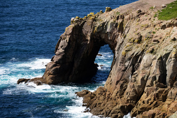 A beautiful view of cliffs and rocks formations on Cornish coastline during summer.