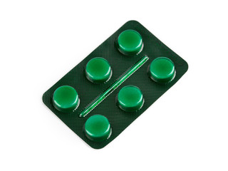 Pills of different colours lay on table. Colorful antibacterials pills, capsules of medicine. Pharmaceuticals antibiotics pills medicine. Blister packs antibiotics and pills top view.