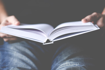 A Mockup white paper in the hands of a man in the home office