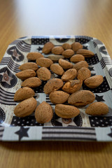 almonds on tray on wooden table