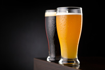 Glasses of unfiltered wheat beer and dark beer