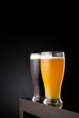 Glasses of dark beer and unfiltered wheat beer