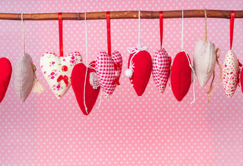 fabric hearts on a pink background