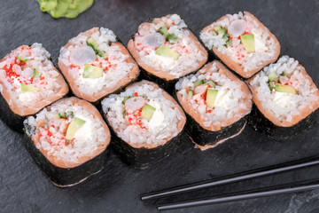 Sushi roll sushi with prawn, avocado, cream cheese, sesame. Sushi menu. Japanese food.