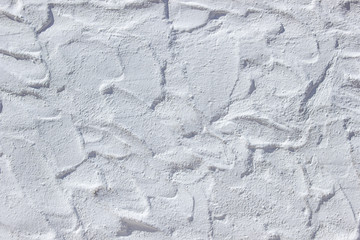 white uneven stucco wall in Mediterranean style, background with architectural elements