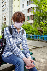 Woman during COVID-19 and flu outbreak with face protection mask. Enjoying nature and sun during quarantine.Concept of coronavirus quarantine. Air pollution