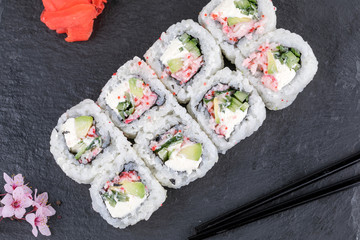 Sushi roll sushi with prawn, avocado, cream cheese, sesame. Sushi menu. Japanese food.