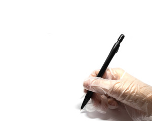 Female hand in sterile gloves writes with a black marker on a white background