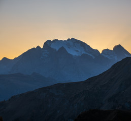 Italian Dolomites mountain peaceful hazy evening dusk view from Giau Pass. Climate, environment and travel concept scene.