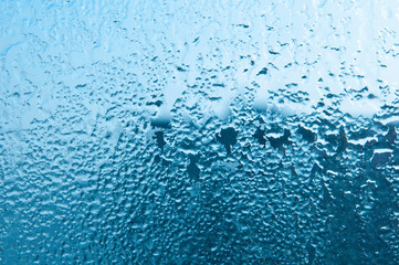 Frozen glass. Frost and glass on moisture.