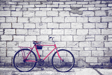 Fototapeta na wymiar Vintage bike, 60s. Beautiful brick wall background with bike.