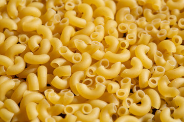 italian dry pasta horns, closeup background scattering, texture