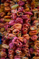 Dry eggplant and dry bell chili hanging on sale at shop