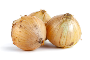 Fototapeta premium Fresh onion bulbs isolated on white background