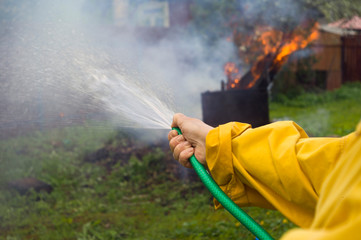 extinguishing fire in a backyard