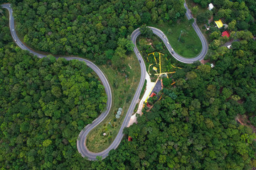 Obraz premium High angle mountain road in the forest of Thailand