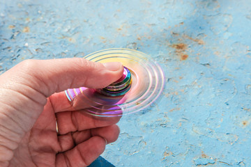 Fidget finger spinner in female hand