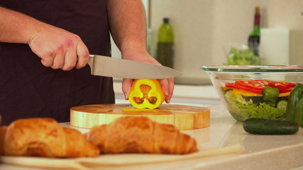 Man cutting bell pepper for frash salad