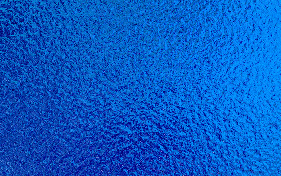 Blue Metallic Foil Paper Texture Background.