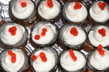 Sushi with melted cheese and caviar on foil. Delicious home delivery.